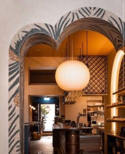 Mosaic archway framing a kitchen