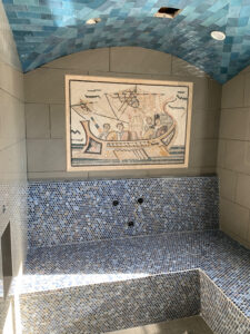 Roman ship mosaic of Ulysses above a plunge pool