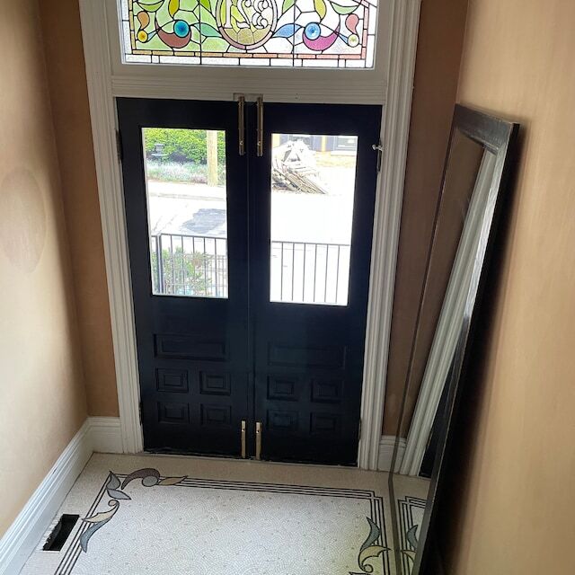 Marble mosaic rug at a front door