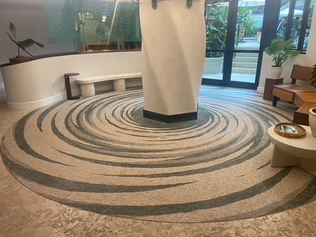 Spiral marble mosaic floor in a modern lobby