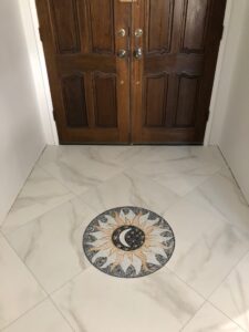 Celestial mosaic medallion in a marble floor